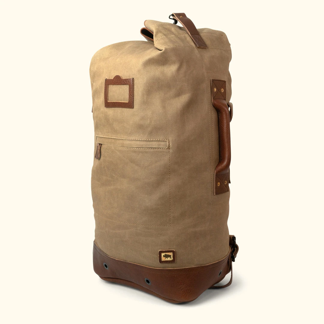 Buffalo Jackson Trading Co. Dakota Waxed Canvas Military Sea Bag Backpack | Field Khaki W/ Chestnut Brown Leather